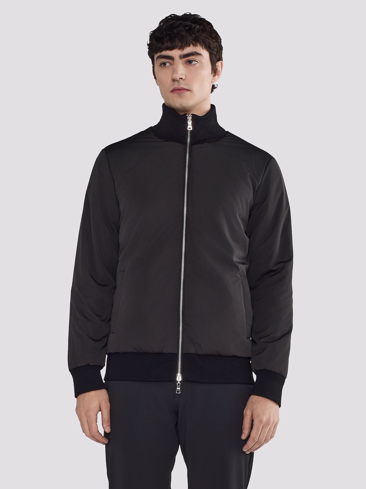 REVERSIBLE BOMBER IN NYLON AND KNIT
