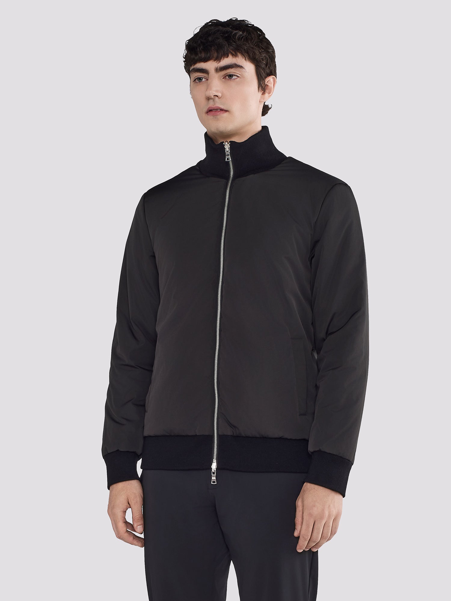 REVERSIBLE BOMBER IN NYLON AND KNIT