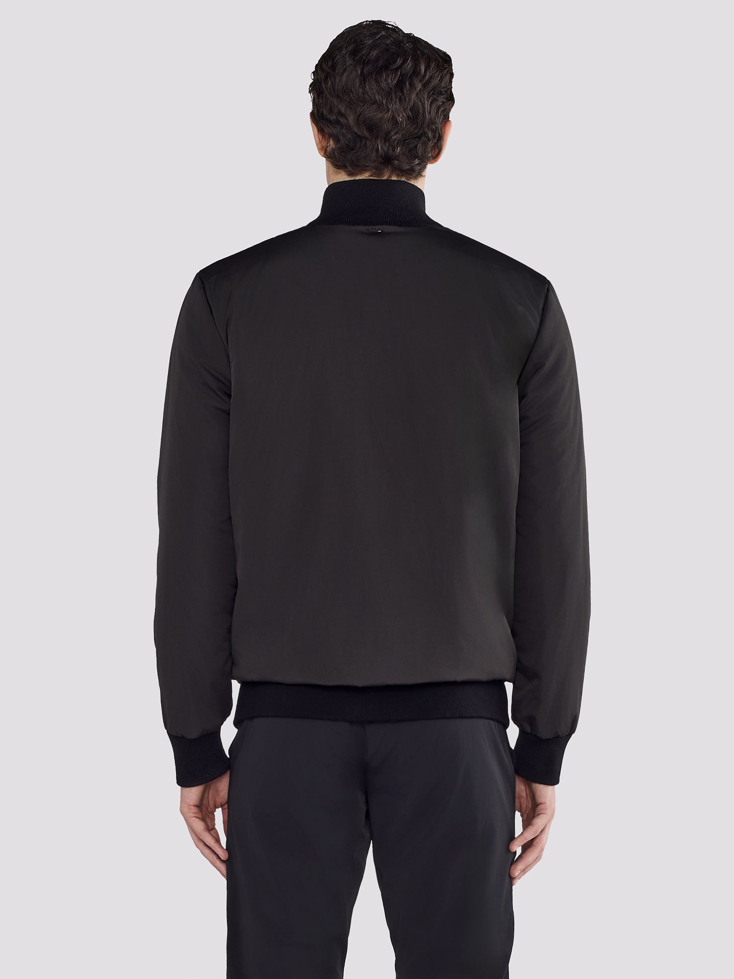 REVERSIBLE BOMBER IN NYLON AND KNIT