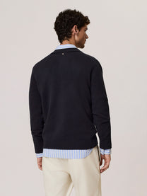 Polo in lana merino con scollo a v