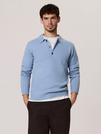 Polo in lana merino con scollo a v