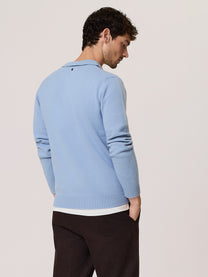 Polo in lana merino con scollo a v