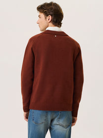 Polo in lana merino con scollo a v